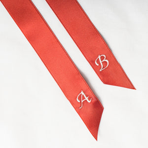 Personalised red ribbon with monogrammed embroidered initials